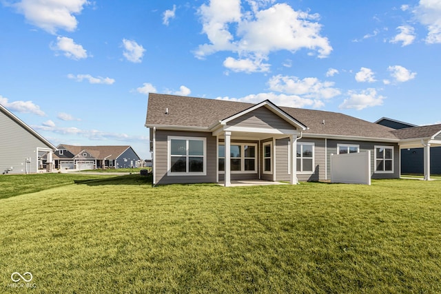 16689 Cattle Hollow Ln, Noblesville, IN 46060 - back of house featuring a lawn, a patio area, and roof with shingles
