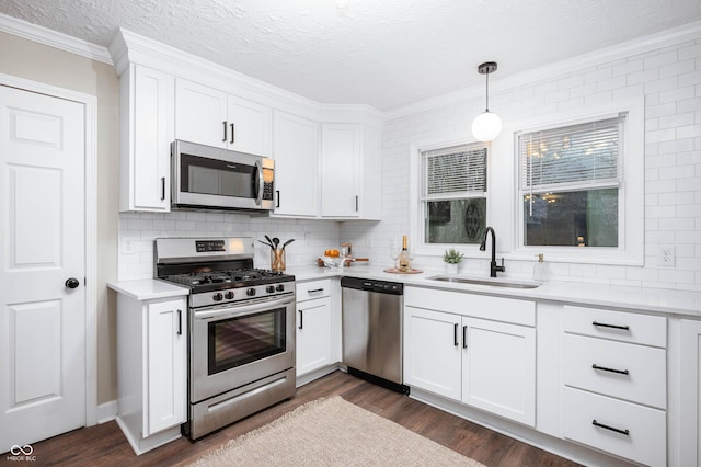 kitchen featuring white cabinetry, sink, and appliances with stainless steel finishes