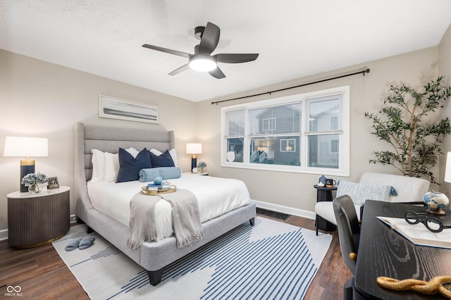 bedroom featuring dark hardwood / wood-style flooring and ceiling fan