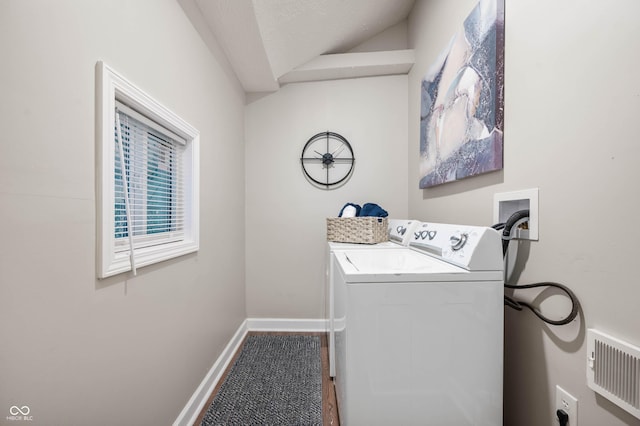 washroom featuring washer and clothes dryer