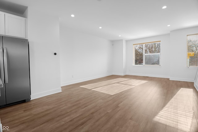 unfurnished living room featuring light hardwood / wood-style flooring