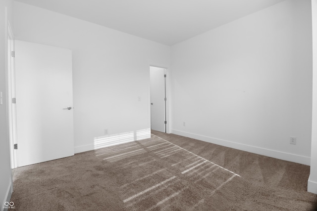 spare room featuring carpet floors