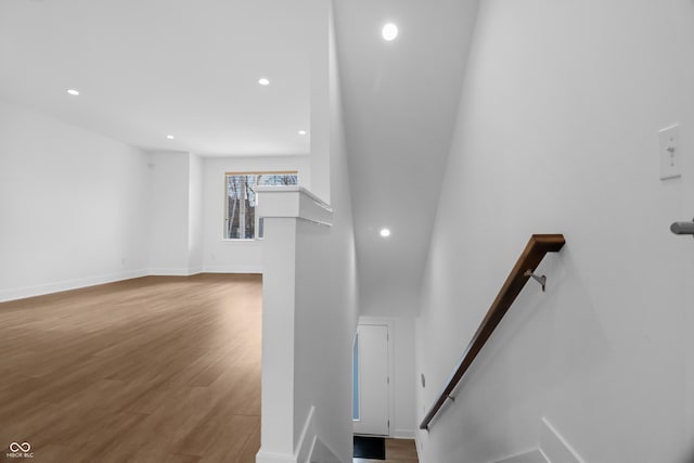 stairs with wood-type flooring