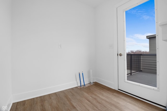 empty room with light hardwood / wood-style flooring