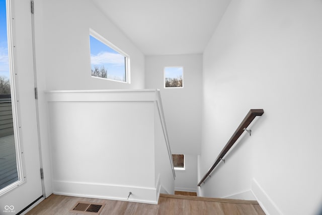 staircase featuring hardwood / wood-style floors