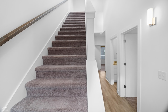 stairs with wood-type flooring