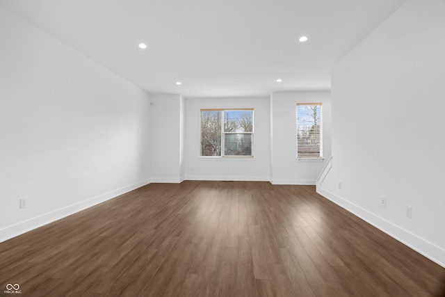 unfurnished room featuring dark hardwood / wood-style flooring