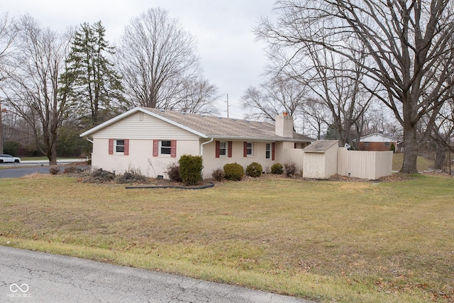 ranch-style house with a front lawn