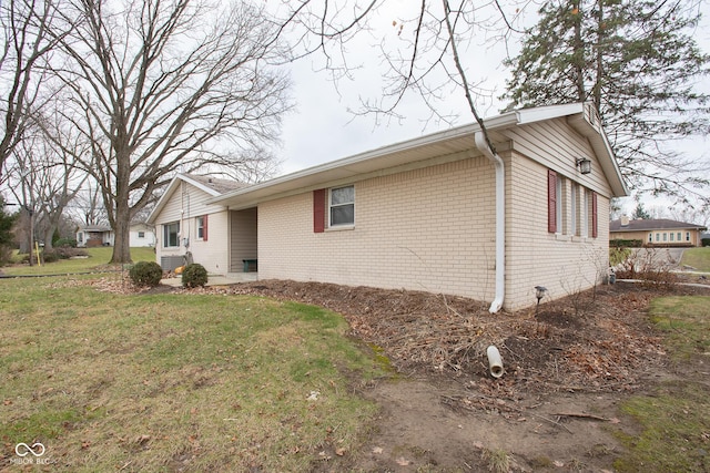 view of home's exterior featuring a lawn