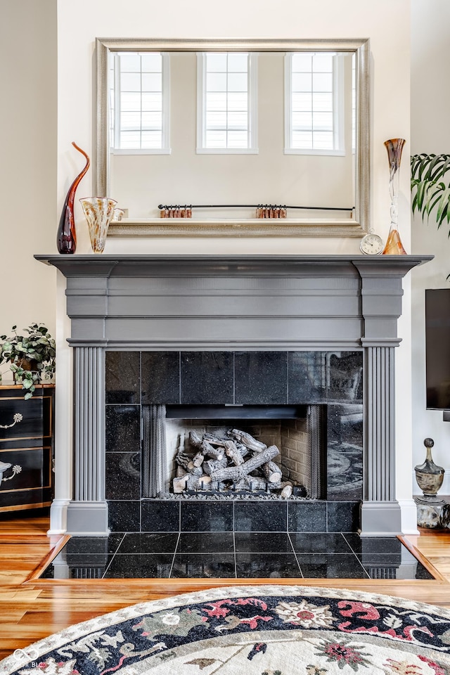 details with a tiled fireplace