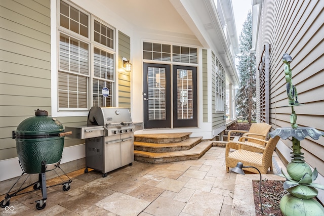 view of patio featuring french doors and a grill