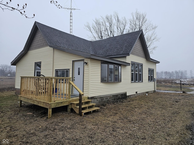 rear view of property with a deck