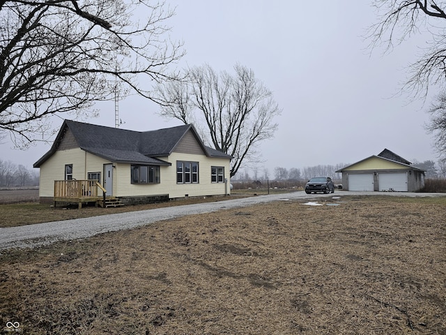 view of home's exterior featuring an outbuilding and a garage