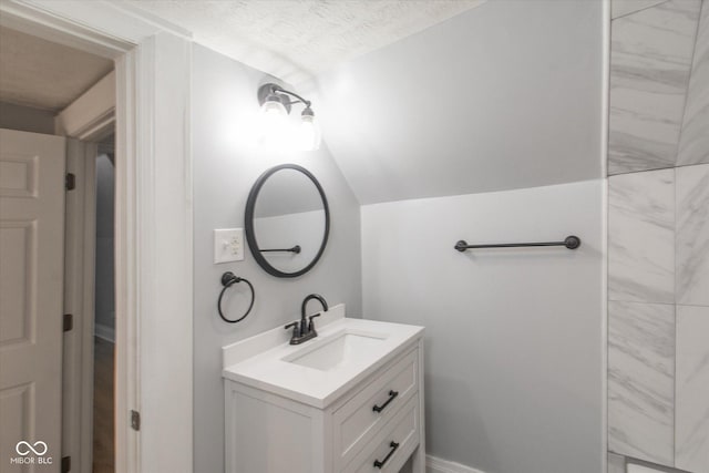 bathroom featuring vanity and a textured ceiling