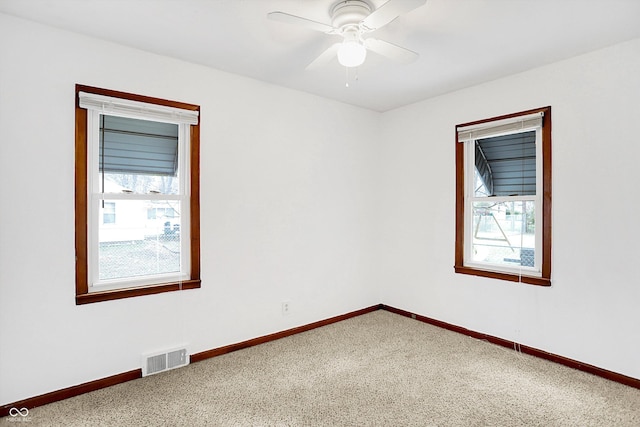 empty room with carpet flooring and ceiling fan