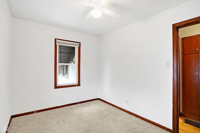 unfurnished room with light carpet and ceiling fan