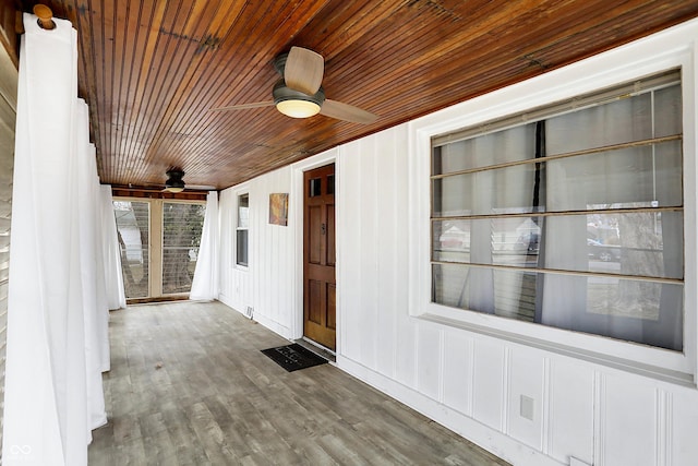 doorway to property with ceiling fan