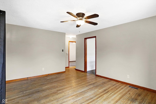 unfurnished room featuring light hardwood / wood-style flooring and ceiling fan