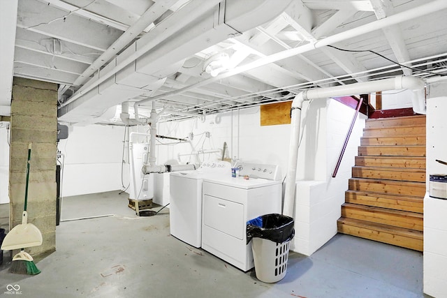 basement featuring washing machine and clothes dryer