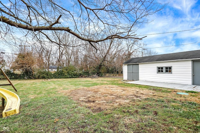 view of yard featuring a patio and an outdoor structure