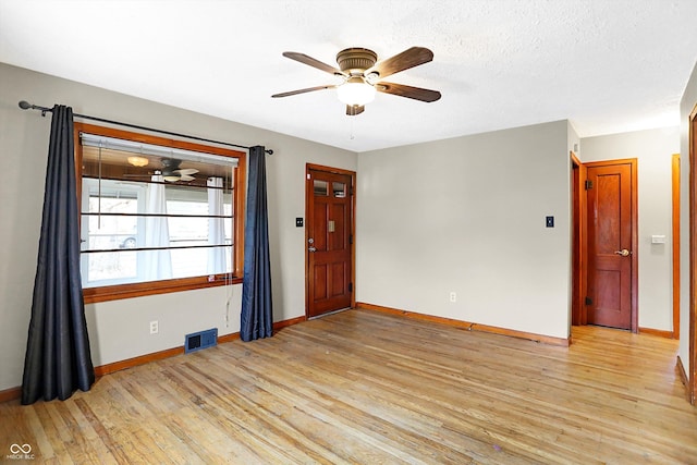 unfurnished room with light hardwood / wood-style flooring and ceiling fan