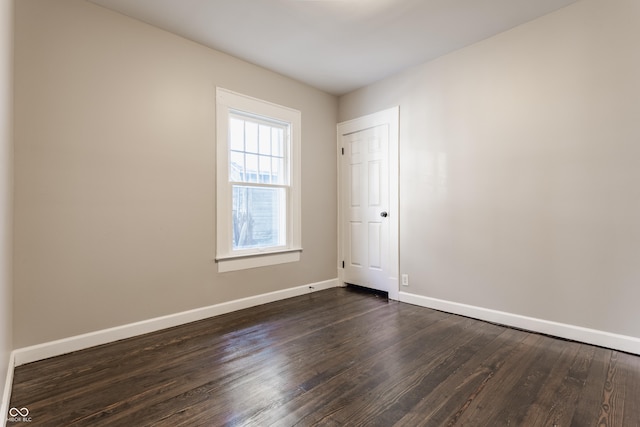 spare room featuring dark hardwood / wood-style flooring