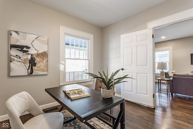 home office with dark wood-type flooring