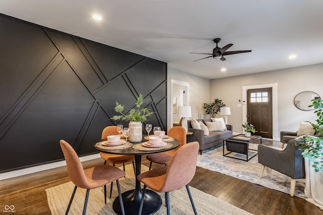 dining area featuring ceiling fan and hardwood / wood-style floors