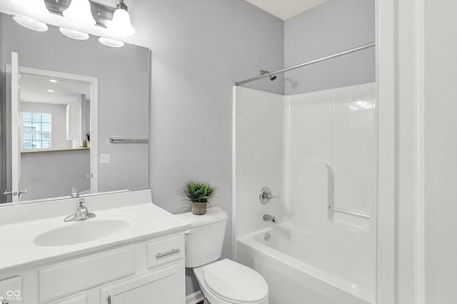 full bathroom featuring shower / bathing tub combination, vanity, and toilet