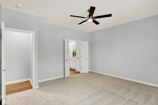 unfurnished bedroom with ceiling fan and light colored carpet