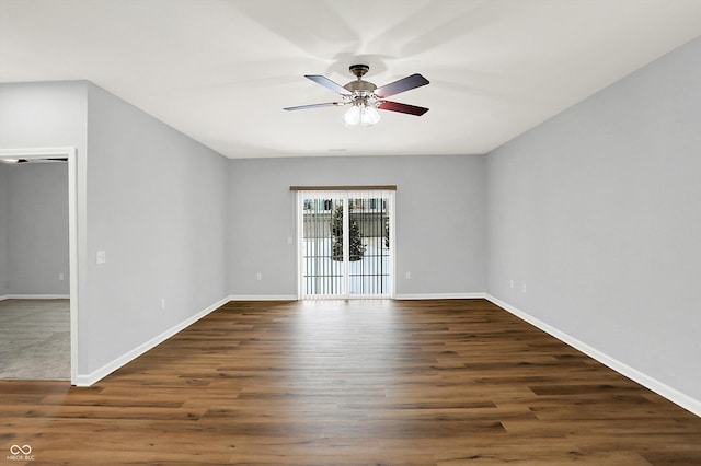 unfurnished room featuring ceiling fan and dark hardwood / wood-style floors