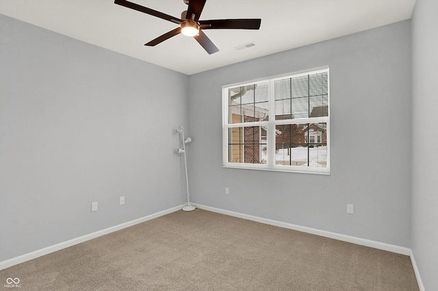 spare room with ceiling fan and carpet floors