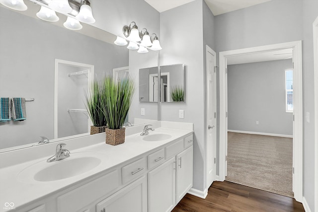 bathroom featuring vanity and hardwood / wood-style flooring