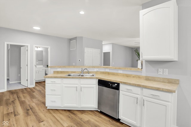 kitchen featuring dishwasher, white cabinets, sink, light hardwood / wood-style floors, and kitchen peninsula