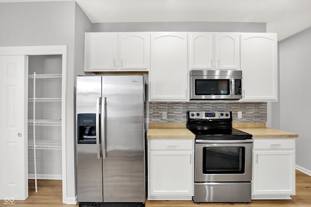 kitchen featuring white cabinetry and stainless steel appliances