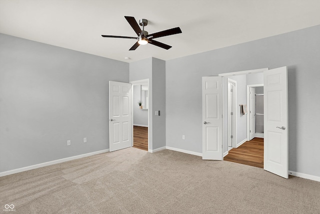 unfurnished bedroom with ceiling fan and carpet floors