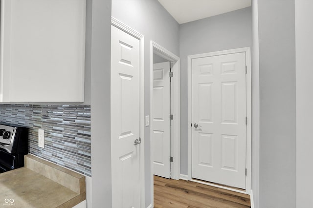 corridor featuring light hardwood / wood-style floors