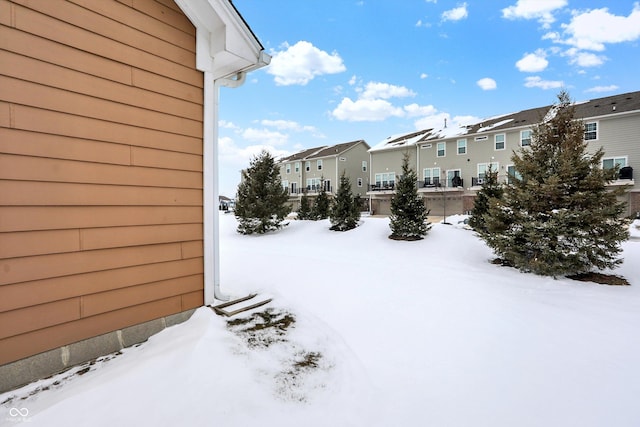 view of yard layered in snow