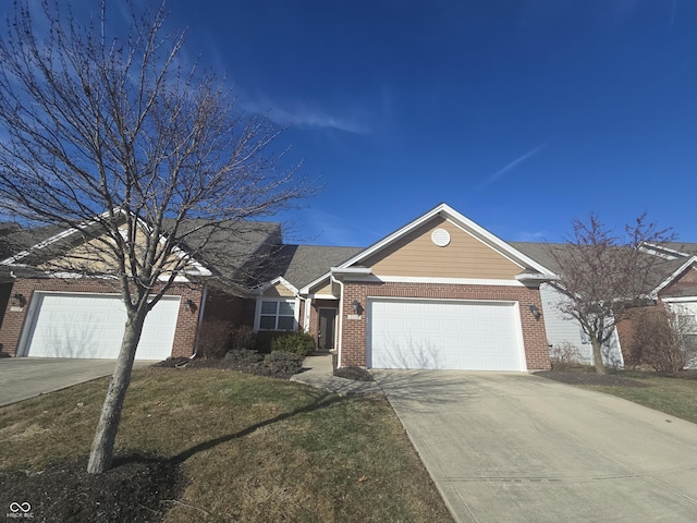 ranch-style home with a garage and a front yard