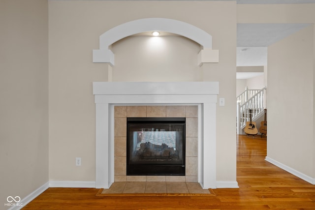 interior details with a fireplace and hardwood / wood-style floors