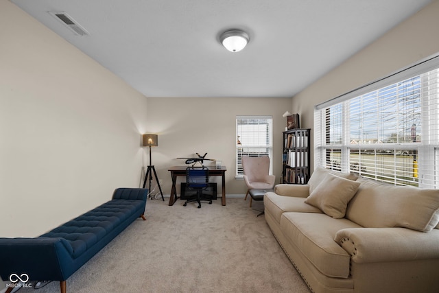 living room featuring light carpet