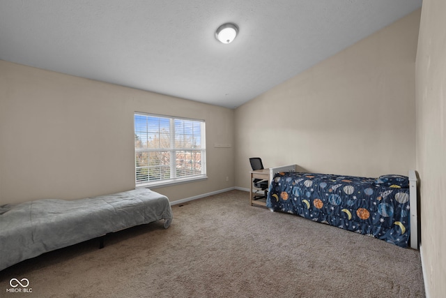 carpeted bedroom featuring lofted ceiling