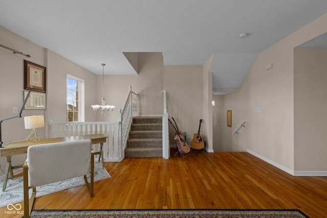 interior space featuring hardwood / wood-style flooring and an inviting chandelier