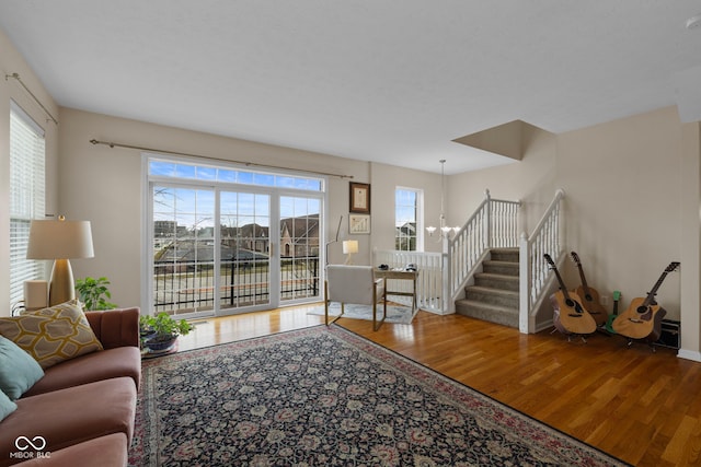 living room with a chandelier and hardwood / wood-style flooring