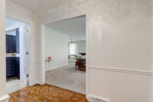 hall with parquet floors and ornamental molding