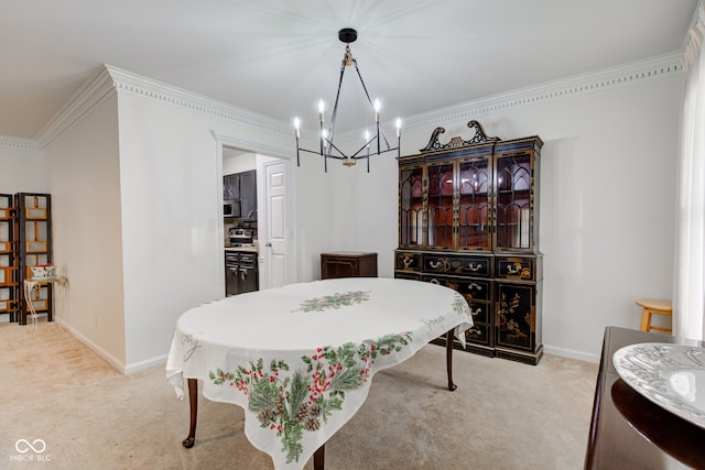 dining area with ornamental molding, light carpet, and a chandelier