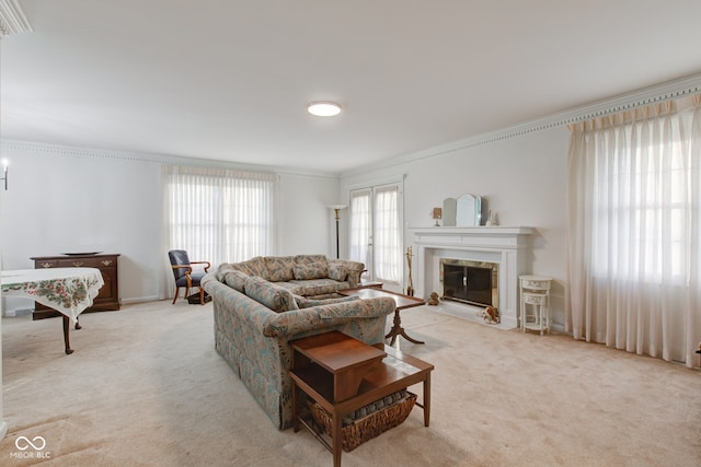 carpeted living room featuring ornamental molding and a high end fireplace