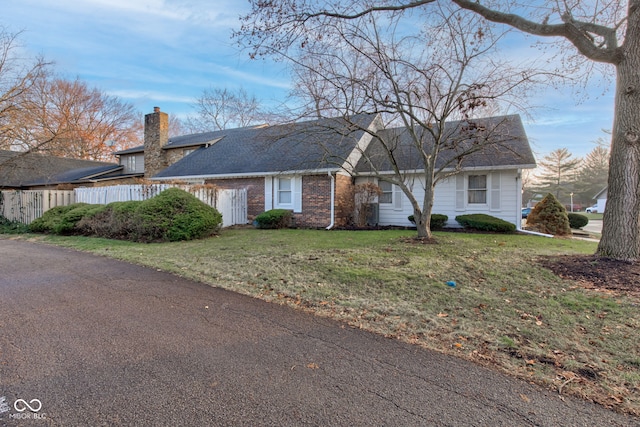 ranch-style house with a front yard