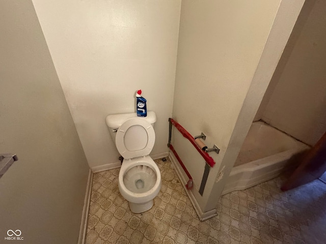 bathroom featuring a bathing tub and toilet