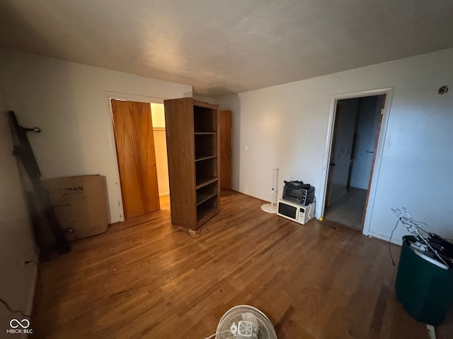 unfurnished living room with hardwood / wood-style floors